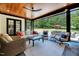 Relaxing screened porch featuring comfortable seating and a view of the backyard at 1209 Briar Patch Ln, Raleigh, NC 27615