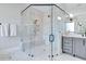 Luxurious walk-in shower with glass surround, marble walls, and modern fixtures at 1209 Briar Patch Ln, Raleigh, NC 27615