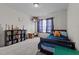 Bright bedroom with a bed, ample space, gray carpeting, and a window with curtains at 126 Thimbleweed Ln, Lillington, NC 27546