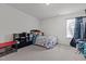 Bright bedroom with a neutral color scheme, a bed with toys, and gray carpeting at 126 Thimbleweed Ln, Lillington, NC 27546