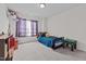 Bright bedroom with a bed, ample space, gray carpeting, and a window with curtains at 126 Thimbleweed Ln, Lillington, NC 27546