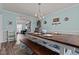 Open dining area with a wooden table and views into the living room at 126 Thimbleweed Ln, Lillington, NC 27546