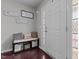 Cozy entryway with a bench, decorative pillows, and hardwood floors at 126 Thimbleweed Ln, Lillington, NC 27546