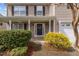 Close up of the front porch with decorative plants and hanging baskets at 126 Thimbleweed Ln, Lillington, NC 27546
