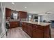 Modern kitchen overlooking the cozy living room, an open design concept at 126 Thimbleweed Ln, Lillington, NC 27546