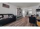 Spacious living room featuring a large sofa, built-in shelving, and an open doorway at 126 Thimbleweed Ln, Lillington, NC 27546