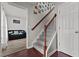 Staircase with hardwood floors, and a view into the living room at 126 Thimbleweed Ln, Lillington, NC 27546