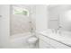 Bathroom featuring a shower-tub combo, a toilet, and a vanity at 1301 Doylin Dr, Cary, NC 27511