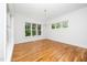 Bright dining room with hardwood floors and natural lighting at 1301 Doylin Dr, Cary, NC 27511
