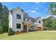 Charming exterior showcasing the home's architectural details, including a covered porch and wood accents at 1301 Doylin Dr, Cary, NC 27511