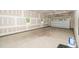 Spacious garage with concrete floors and insulated door at 1301 Doylin Dr, Cary, NC 27511