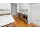 Kitchen featuring marble countertops and stainless microwave and oak cabinets at 1301 Doylin Dr, Cary, NC 27511