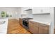 Kitchen showcasing stainless steel range, marble countertops, white backsplash, and oak cabinets at 1301 Doylin Dr, Cary, NC 27511
