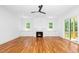The living room features hardwood floors, fireplace, built-in cabinets and access to the outdoors at 1301 Doylin Dr, Cary, NC 27511