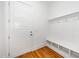 Mud room boasts a five panel door, hardwood floors, and built-in storage at 1301 Doylin Dr, Cary, NC 27511