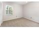 Clean bedroom with bright window and neutral paint and carpet at 1324 Swallow Dr, Raleigh, NC 27606