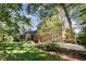 Charming two-story home featuring a brick exterior and spacious backyard at 1324 Swallow Dr, Raleigh, NC 27606