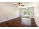 Open living room with wood-look flooring and natural light from the picture window at 1324 Swallow Dr, Raleigh, NC 27606
