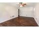 Bright living room features wood-look flooring, neutral walls and trim, plus modern ceiling fan and light fixture at 1324 Swallow Dr, Raleigh, NC 27606