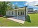Spacious back yard with patio and green lawn at 15 Nottingham Pl, Smithfield, NC 27577