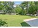 Expansive backyard with lush green grass and mature trees offering privacy at 15 Nottingham Pl, Smithfield, NC 27577
