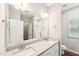Bathroom vanity with double sinks, granite countertops and a large mirror over the countertop at 15 Nottingham Pl, Smithfield, NC 27577