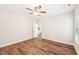 Comfortable bedroom features wood flooring, a ceiling fan, and a bright neutral color scheme at 15 Nottingham Pl, Smithfield, NC 27577