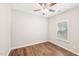 Bright bedroom with hardwood floors, a ceiling fan, and natural light from the window at 15 Nottingham Pl, Smithfield, NC 27577