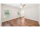 Spacious bedroom offers wood flooring, natural light from two windows, and entry to a bathroom at 15 Nottingham Pl, Smithfield, NC 27577