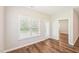 Bright dining area features wood flooring, white trim, and natural light from one large window at 15 Nottingham Pl, Smithfield, NC 27577