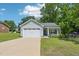 Charming single-story home with a two-car garage and well-maintained front yard at 15 Nottingham Pl, Smithfield, NC 27577
