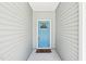 A welcoming, light blue front door provides curb appeal at 15 Nottingham Pl, Smithfield, NC 27577