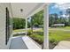 Covered porch with view of the street and neighboring houses at 15 Nottingham Pl, Smithfield, NC 27577