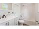 Bright bathroom with white vanity, shower, and tile flooring at 1508 Malta Ave, Raleigh, NC 27610