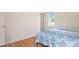 Bedroom with wood floors and natural light at 1508 Malta Ave, Raleigh, NC 27610