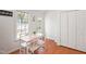 The breakfast nook showcases a table and chairs, natural light and wood flooring, leading to the outdoor deck at 1508 Malta Ave, Raleigh, NC 27610