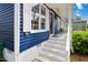 Inviting front porch with white brick steps and views of the front door at 1508 Malta Ave, Raleigh, NC 27610