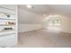 Bonus room with carpet, a window, and a ceiling fan at 1604 Westbridge Ct, Raleigh, NC 27606
