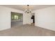 Bright dining room with view into the kitchen and living room spaces at 1604 Westbridge Ct, Raleigh, NC 27606