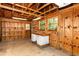 Wood paneled garage with work bench and shelving is a craftsman's dream at 1604 Westbridge Ct, Raleigh, NC 27606