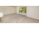 Open living room featuring a large window providing ample natural light at 1604 Westbridge Ct, Raleigh, NC 27606