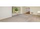 Living room featuring neutral carpet and natural light from the window at 1604 Westbridge Ct, Raleigh, NC 27606