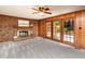 Living room featuring brick fireplace and access to the outdoor area at 1604 Westbridge Ct, Raleigh, NC 27606