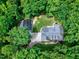An aerial shot of the property shows the lovely home and the detached garage with a driveway at 168 E Deer, Apex, NC 27523
