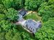 An aerial shot of the property shows the lovely home and the detached garage with a driveway at 168 E Deer, Apex, NC 27523