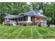 Charming two-story home with a well-manicured lawn, fenced yard, and a screened-in porch at 168 E Deer, Apex, NC 27523