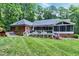 Beautiful backyard featuring a large deck, hot tub, and lush green lawn perfect for relaxation at 168 E Deer, Apex, NC 27523