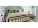 Stylish bedroom with sloped ceilings, hardwood floors, comfortable bedding, and decor at 168 E Deer, Apex, NC 27523