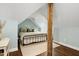Charming bedroom with a sloped ceiling, stylish decor, and a cozy atmosphere at 168 E Deer, Apex, NC 27523