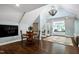 Upstairs bonus room features a round dining table, hardwood floors, and an abundance of light at 168 E Deer, Apex, NC 27523